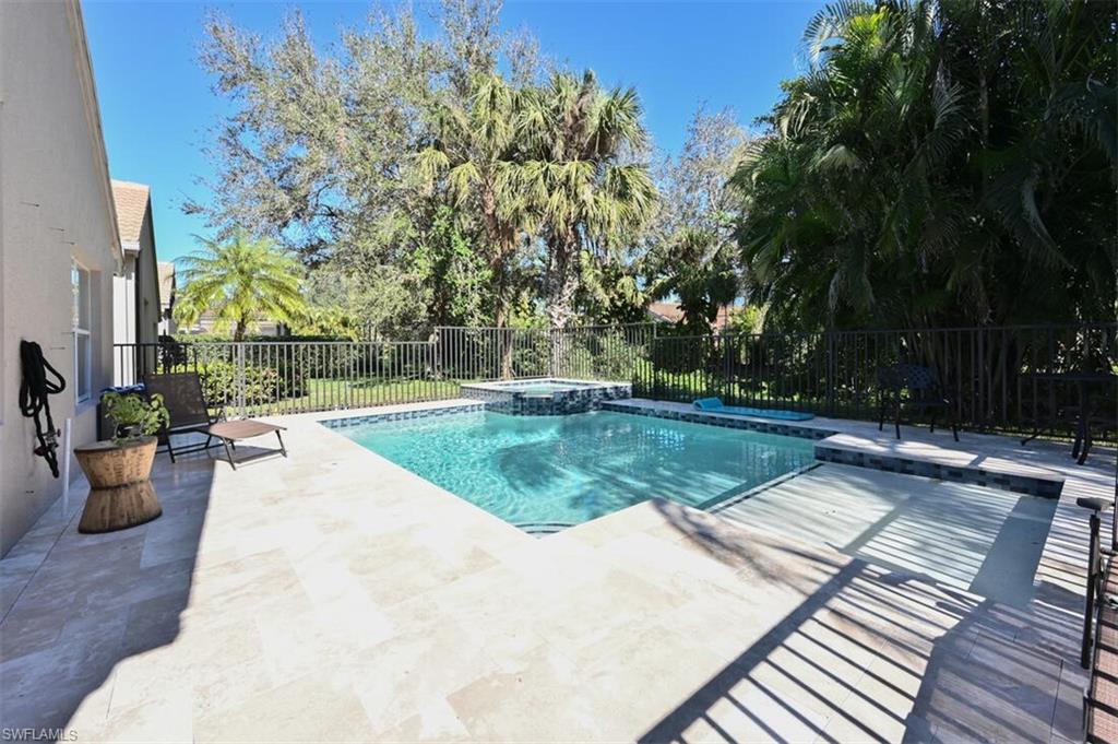 1346 Triandra Lane Naples, FL 34119 - Photo 16 of 19 a view of a backyard