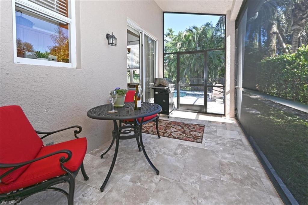 1346 Triandra Lane Naples, FL 34119 - Photo 19 of 19 a living room with furniture and a potted plant