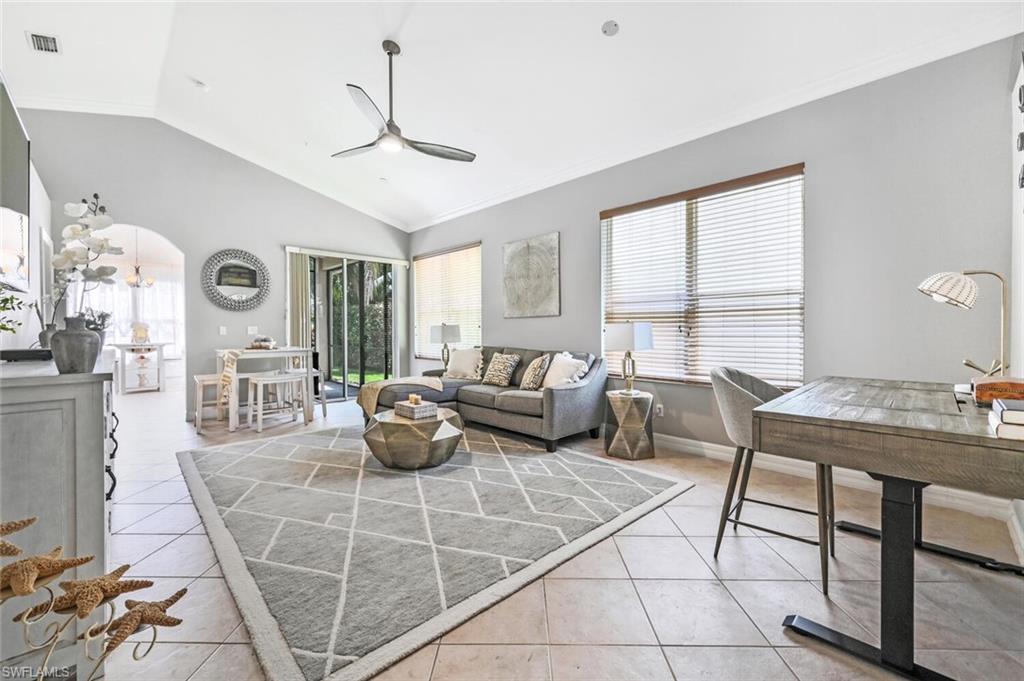 1346 Triandra Lane Naples, FL 34119 - Photo 5 of 19 a living room with furniture and wooden floor
