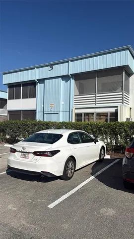 a car parked in front of a house