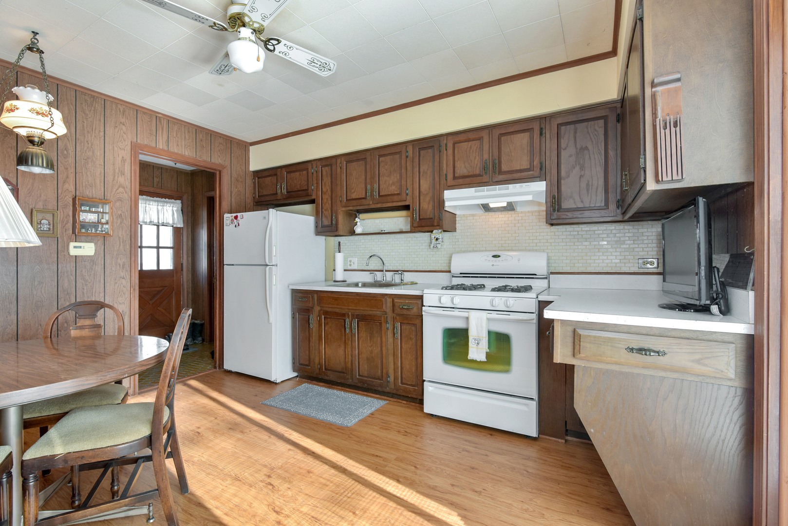 3541 Techny Road Northbrook, IL 60062 - Photo 20 of 25 a kitchen with a stove cabinets and chairs