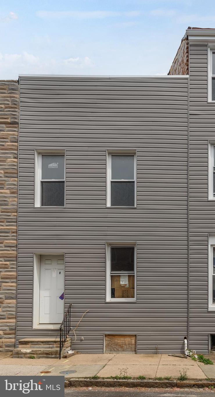a front view of a house with street