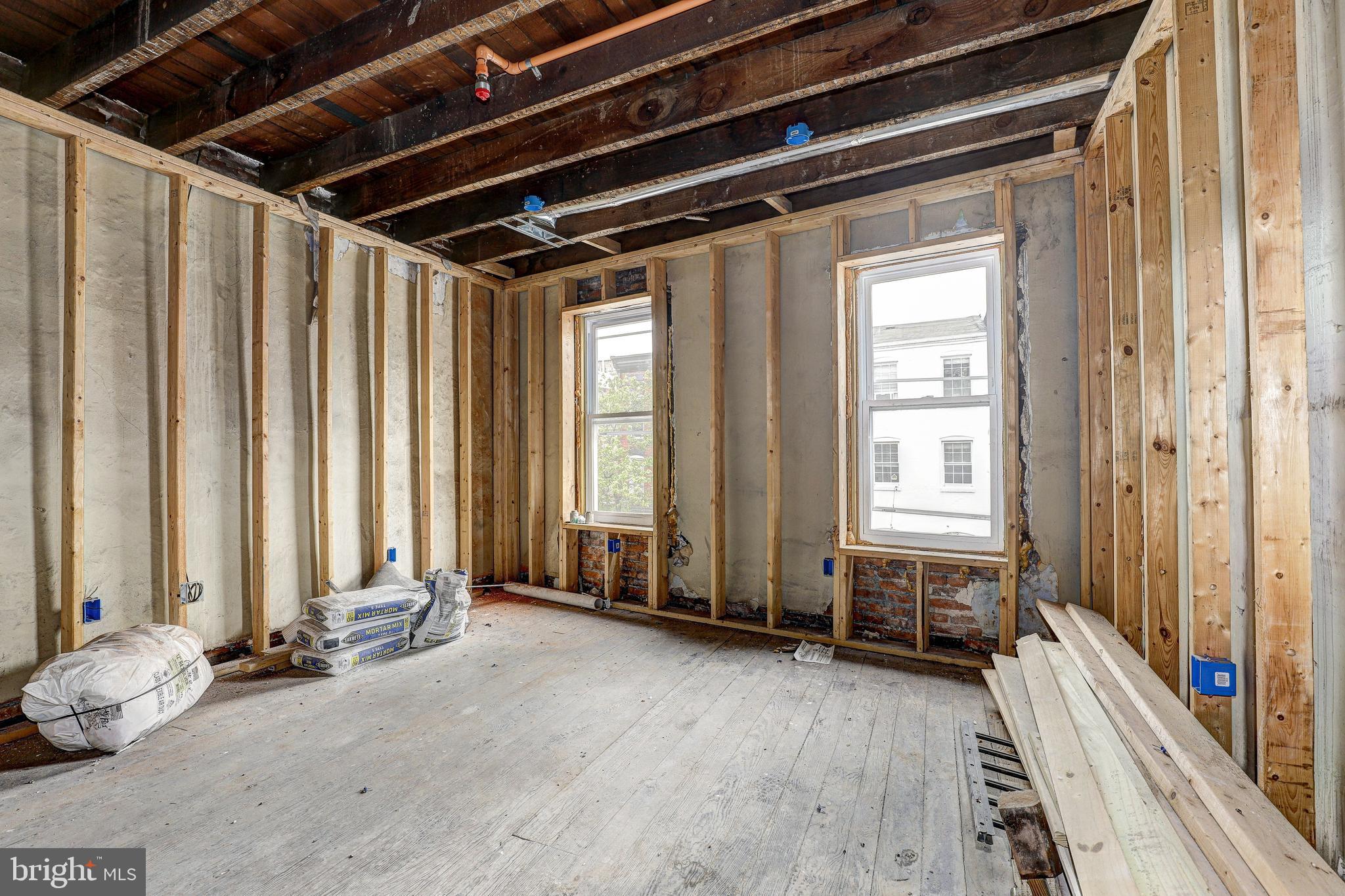 1729 Light Street Baltimore, MD 21230 - Photo 20 of 37 a view of a room with wooden floor and furniture