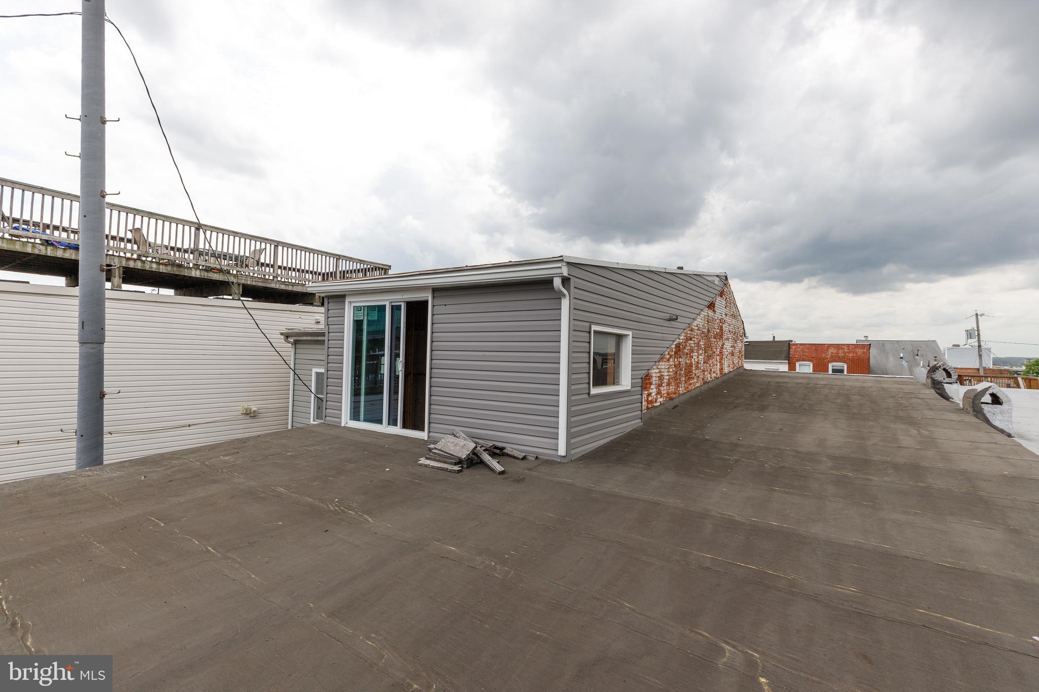 1729 Light Street Baltimore, MD 21230 - Photo 30 of 37 a view of a house with a garage