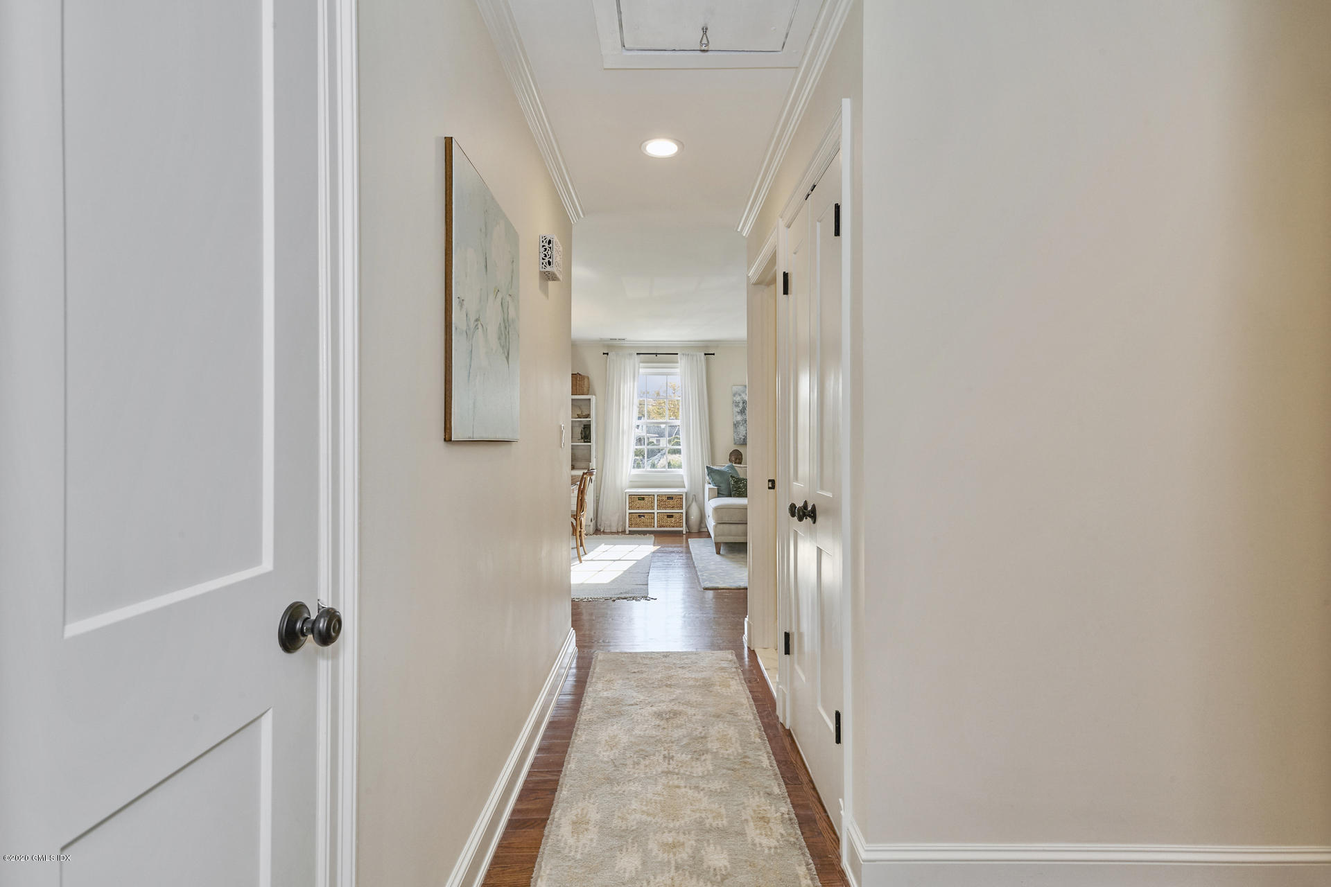102 Valley Road, Unit 25 Cos Cob, CT 06807 - Photo 19 of 21 a view of a hallway with a livingroom and a bathroom with a sink