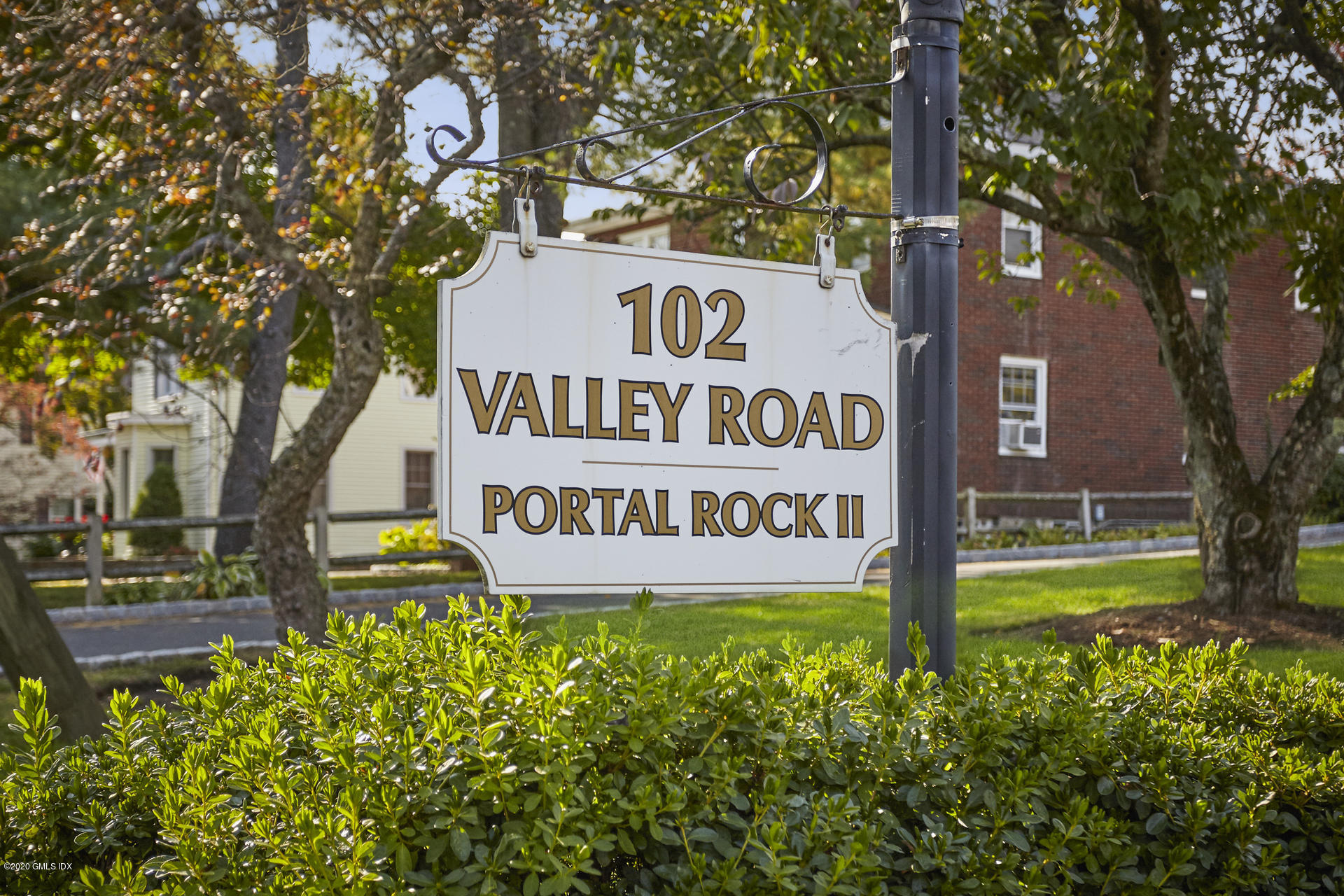 102 Valley Road, Unit 25 Cos Cob, CT 06807 - Photo 3 of 21 a sign on the side of a tree