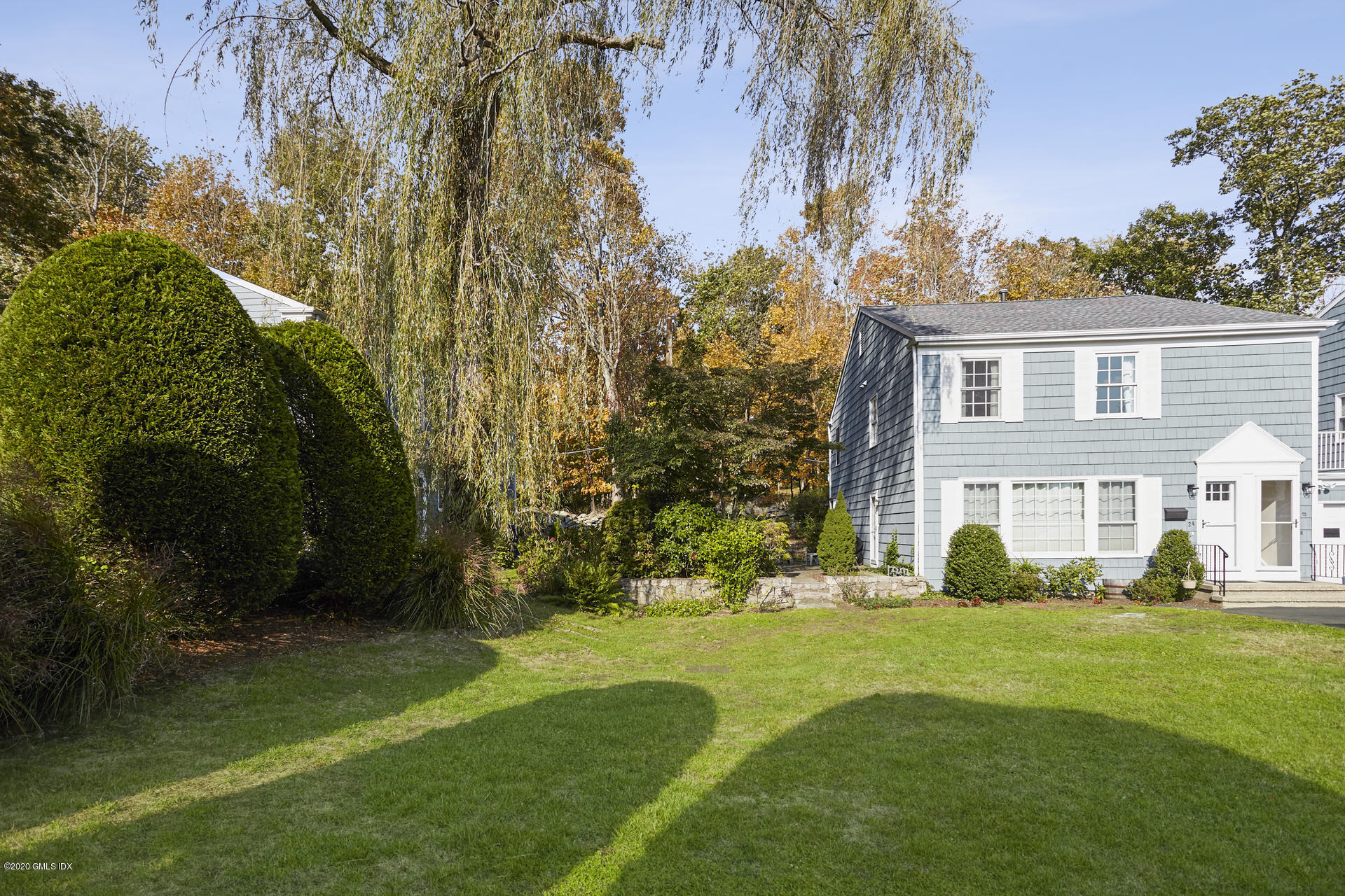 102 Valley Road, Unit 25 Cos Cob, CT 06807 - Photo 4 of 21 a front view of a house with a yard