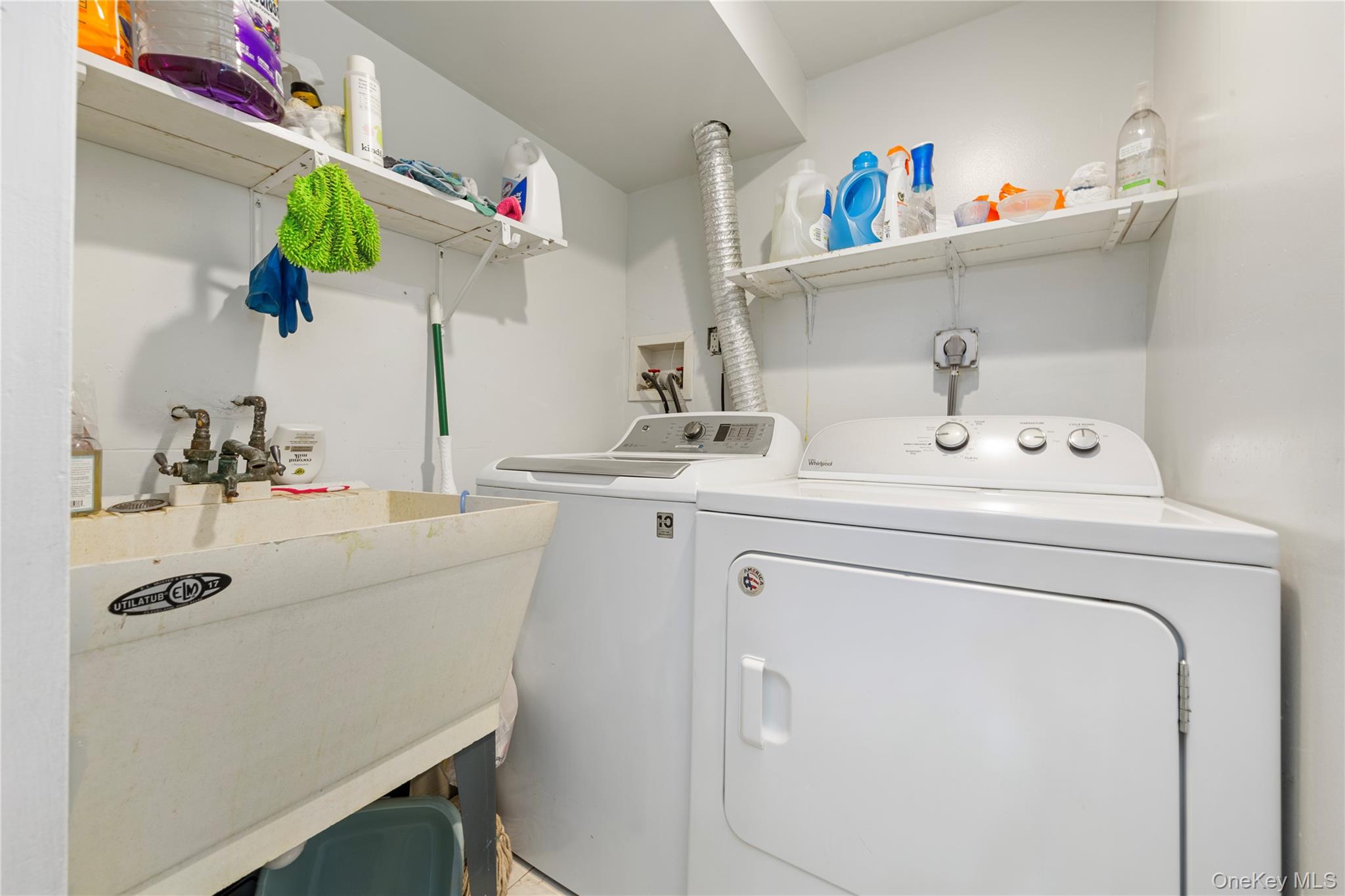 11 Dewitt Street Valley Stream, NY 11580 - Photo 18 of 21 Laundry room with washing machine and clothes dryer
