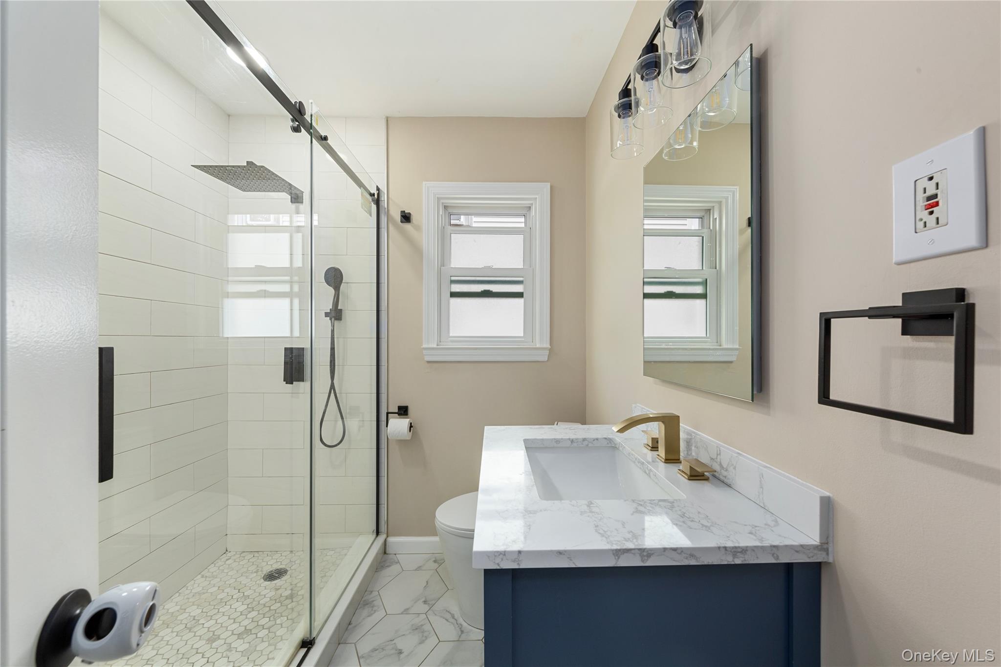 11 Dewitt Street Valley Stream, NY 11580 - Photo 21 of 21 Full bathroom with vanity, a stall shower, and light marble finish floors