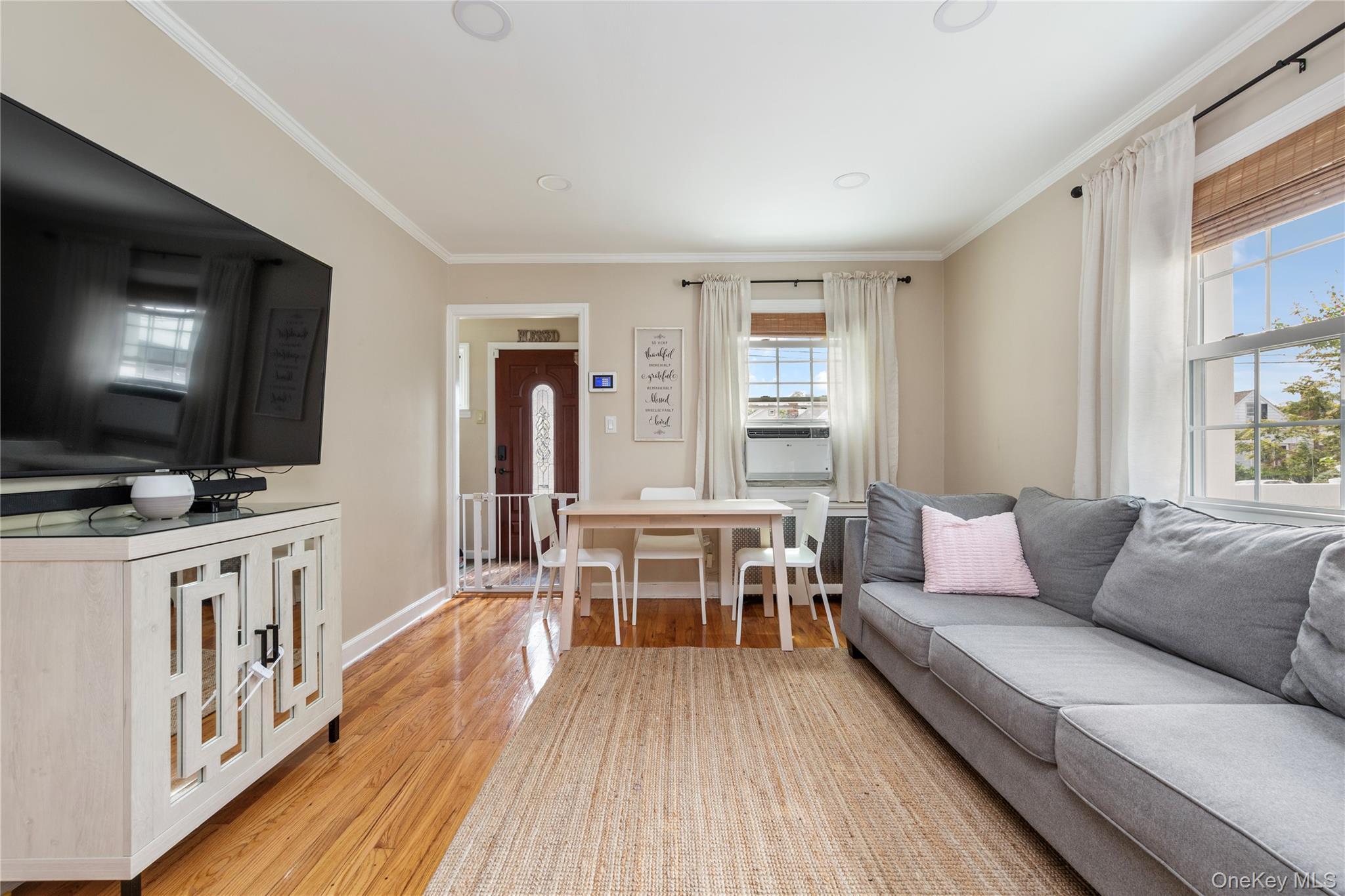 11 Dewitt Street Valley Stream, NY 11580 - Photo 5 of 21 Living room with ornamental molding, light wood-style floors, and recessed lighting
