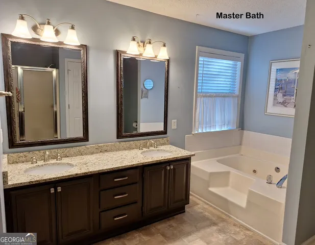 an empty room with closet and a ceiling fan