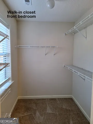 a view of furniture and storage in a room