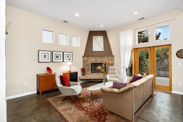 a dining room with furniture and a window