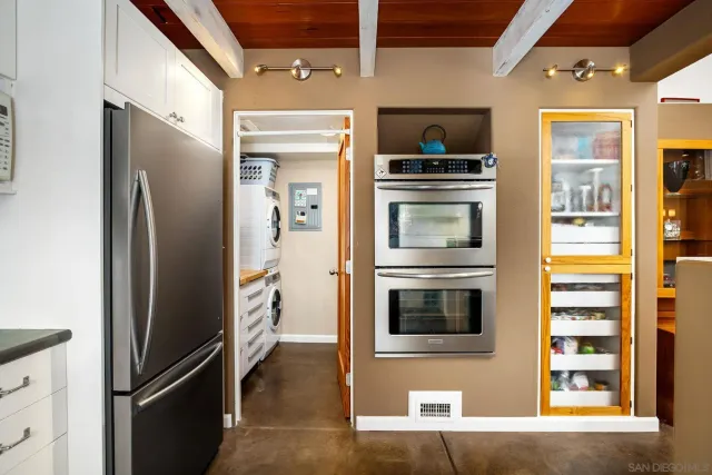 a view of an entryway with wooden floor and windows