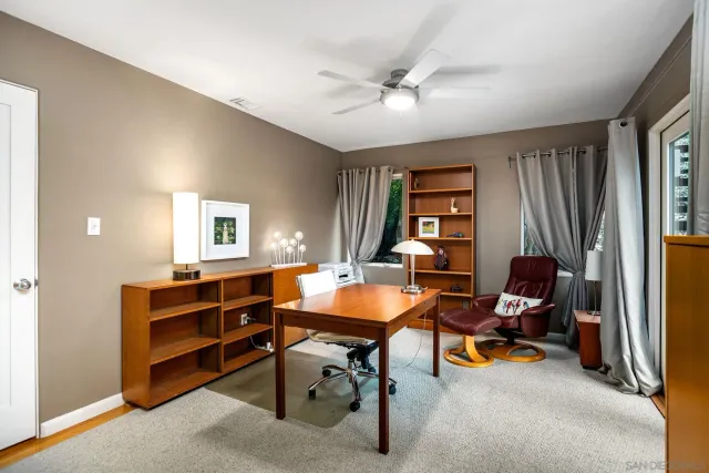 a bedroom with bed and window