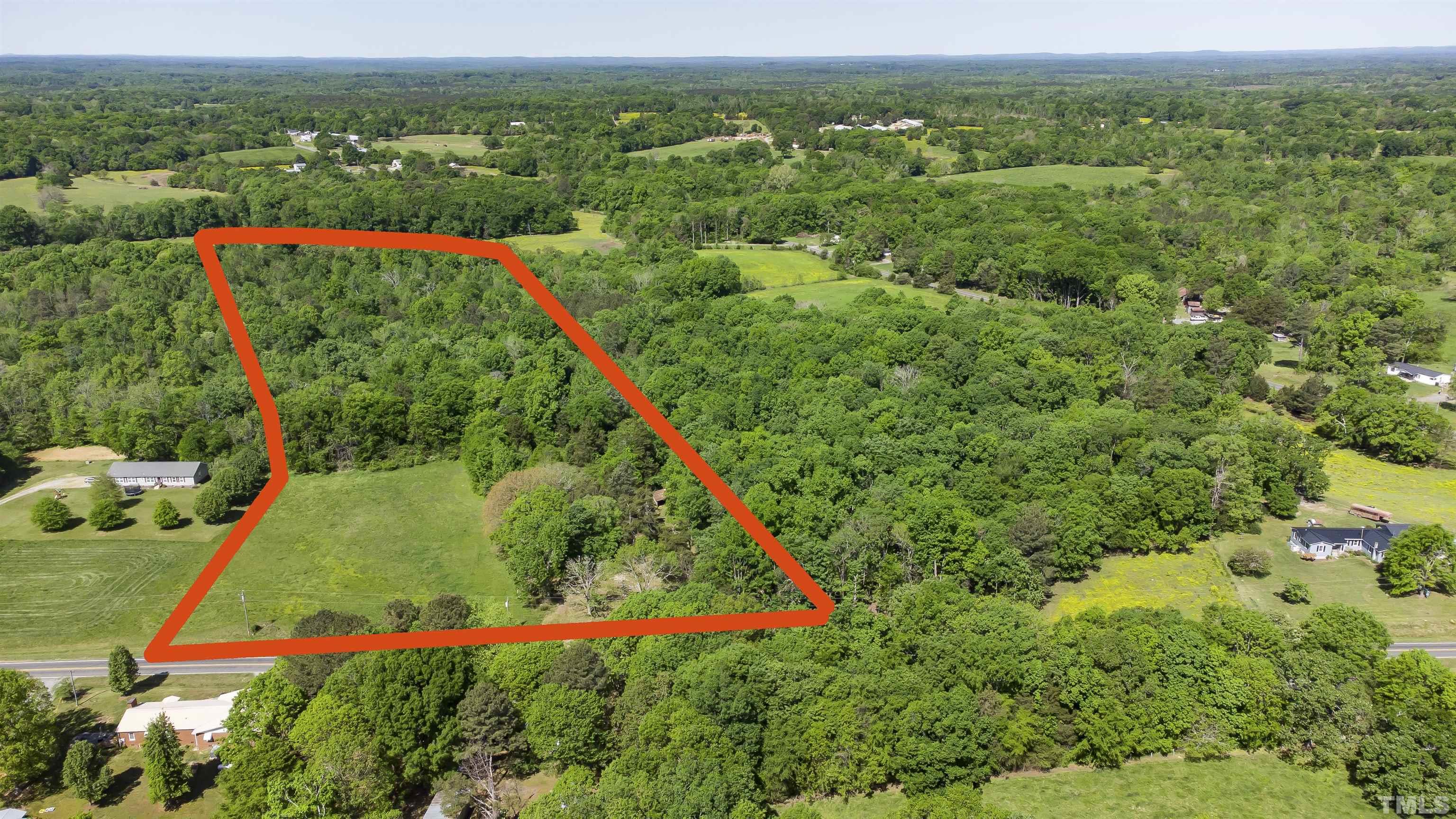 740 Bernard Purvis Road Bennett, NC 27208 - Photo 1 of 23 a view of a lush green field