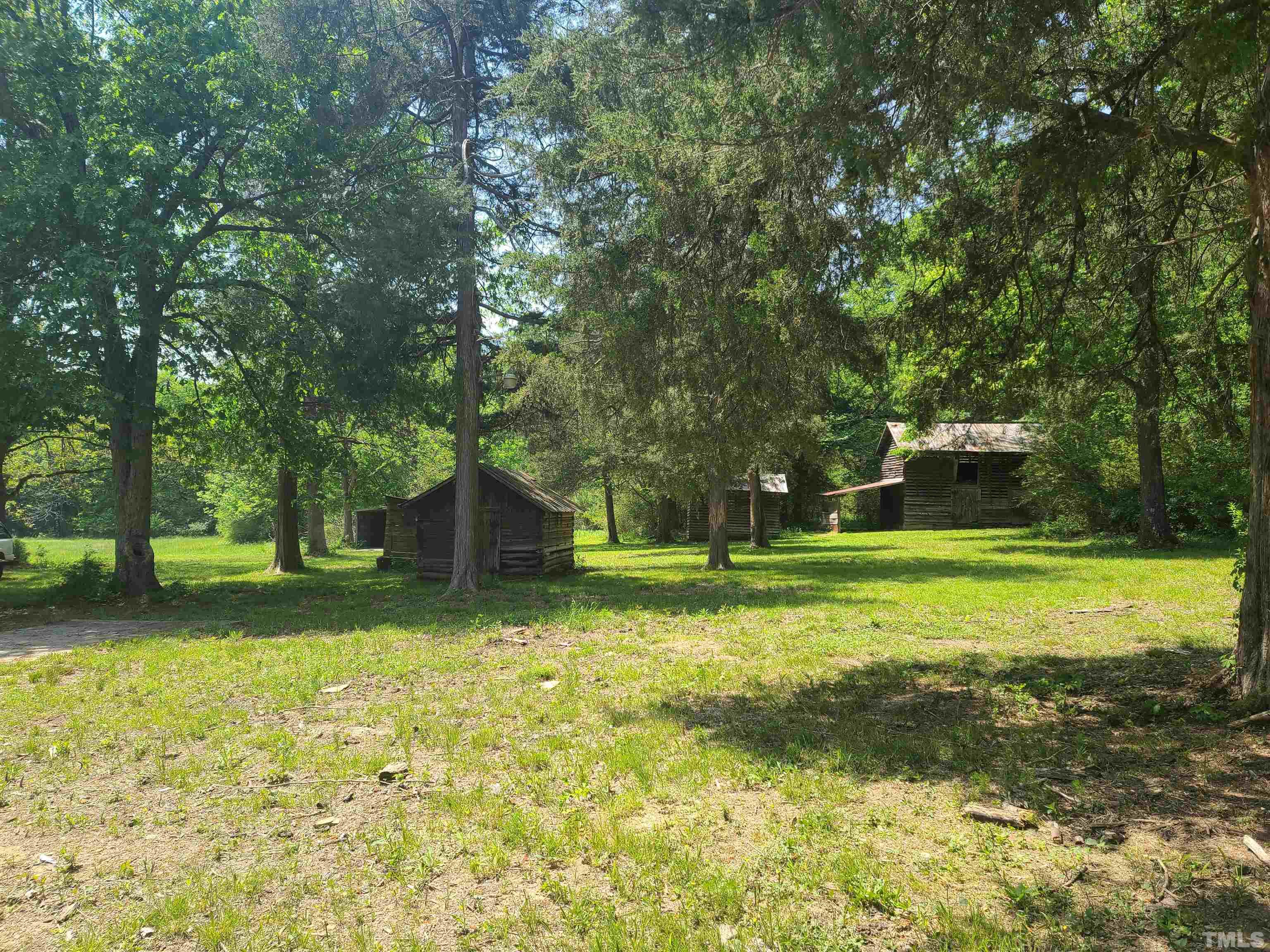 740 Bernard Purvis Road Bennett, NC 27208 - Photo 16 of 23 a front view of a house with a yard