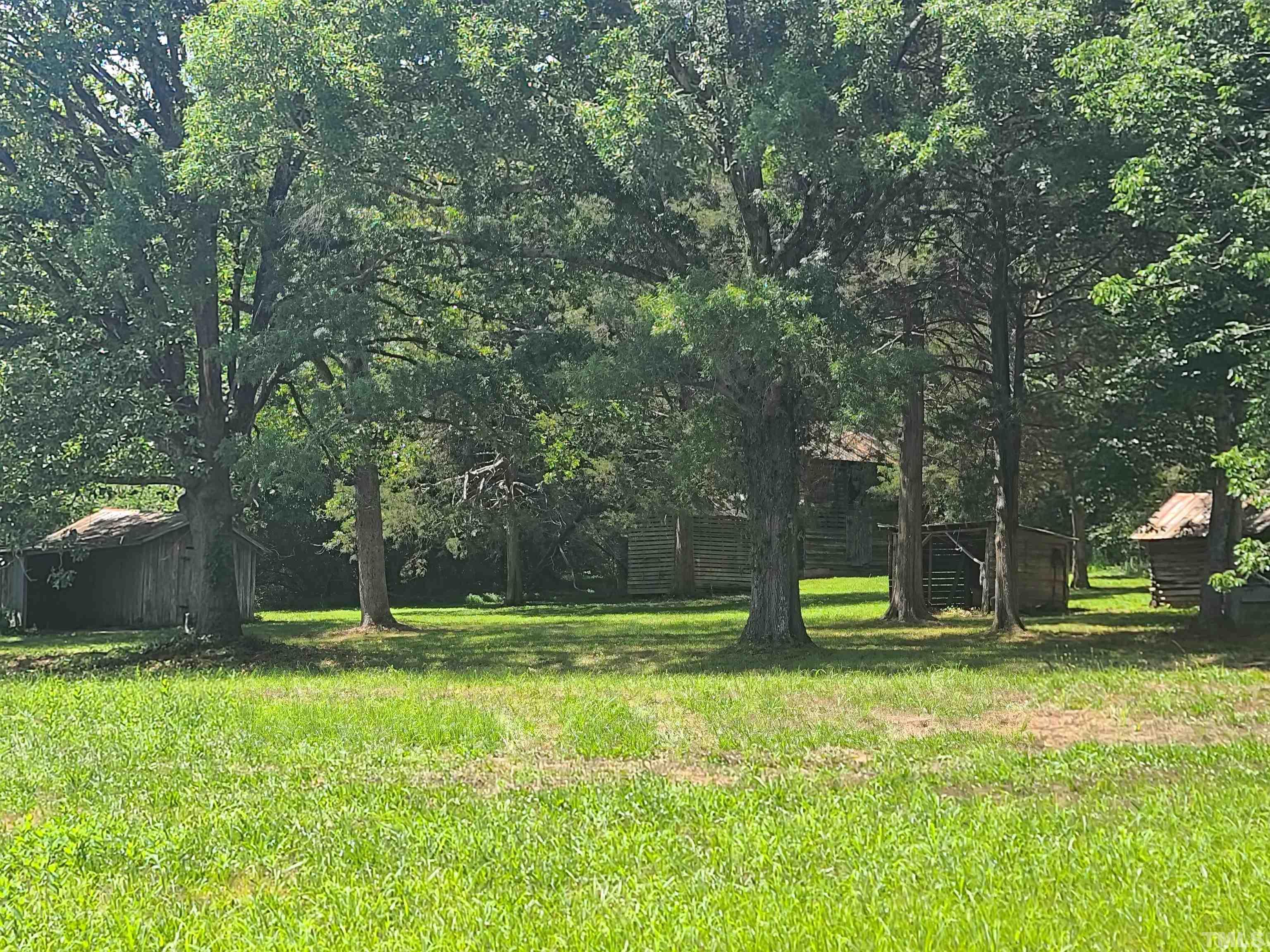 740 Bernard Purvis Road Bennett, NC 27208 - Photo 20 of 23 a view of outdoor space with deck and yard