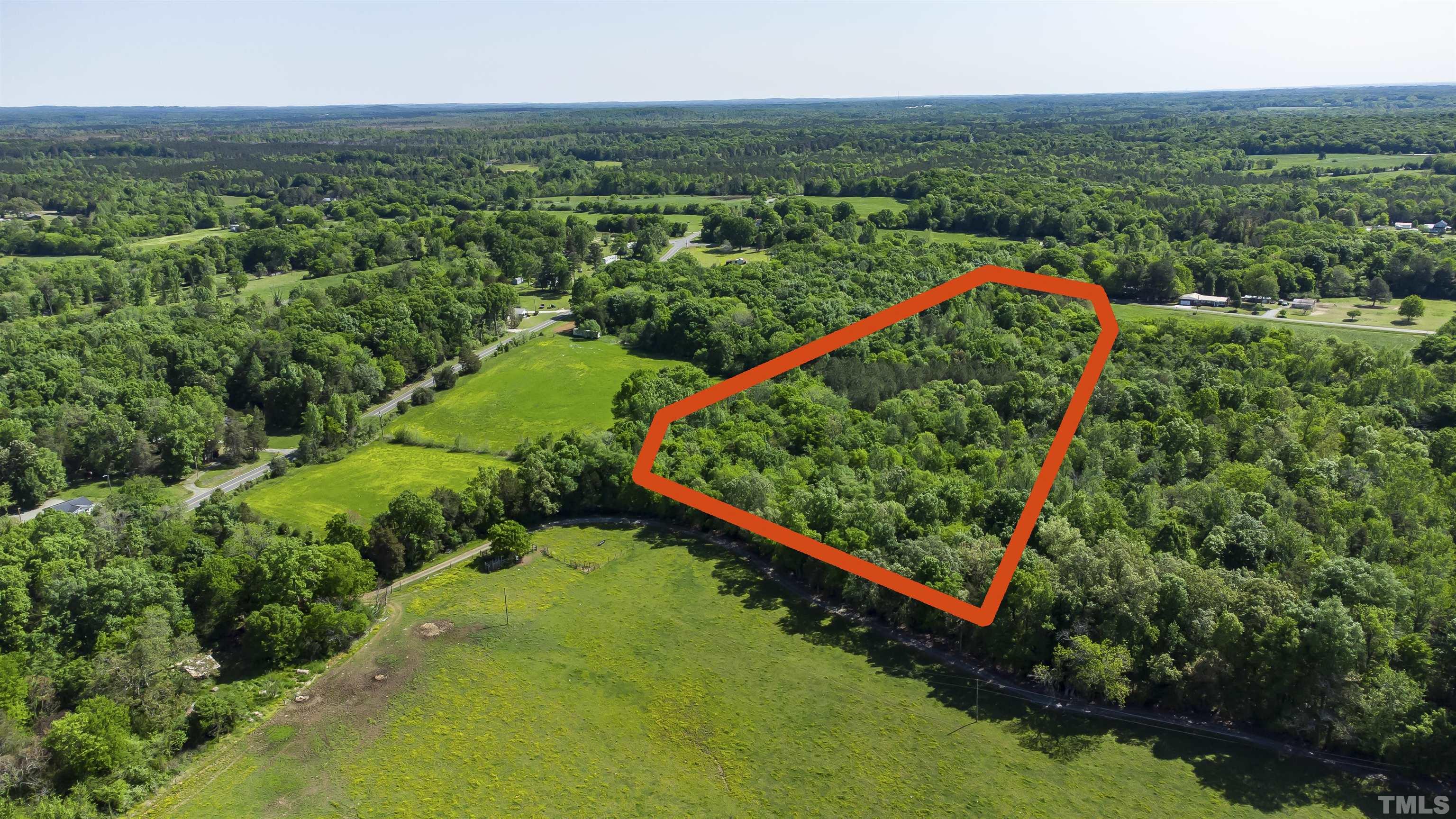 740 Bernard Purvis Road Bennett, NC 27208 - Photo 2 of 23 a view of a yard with a garden