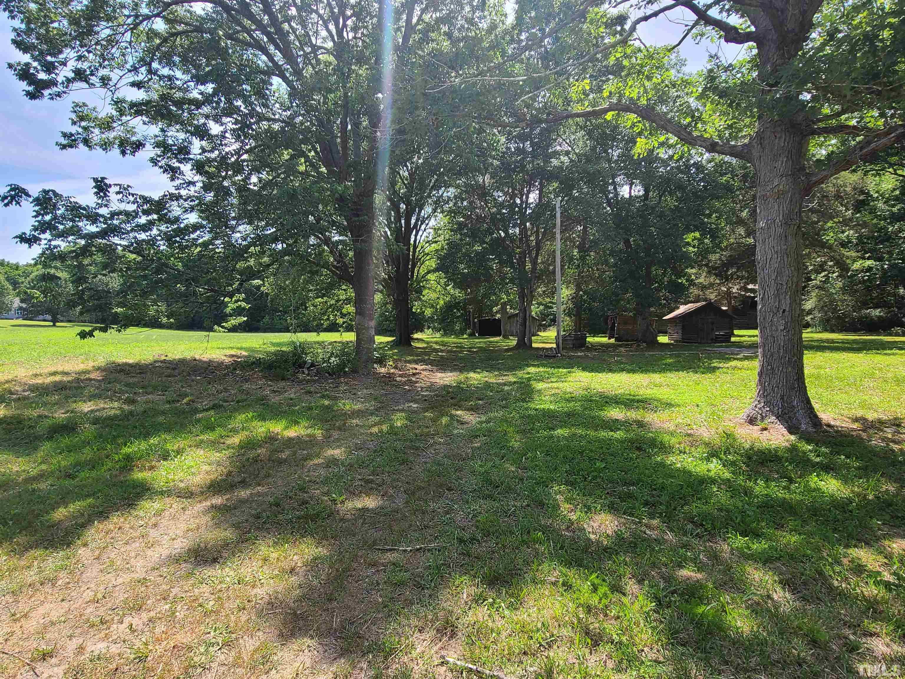740 Bernard Purvis Road Bennett, NC 27208 - Photo 23 of 23 a view of outdoor space with deck and yard