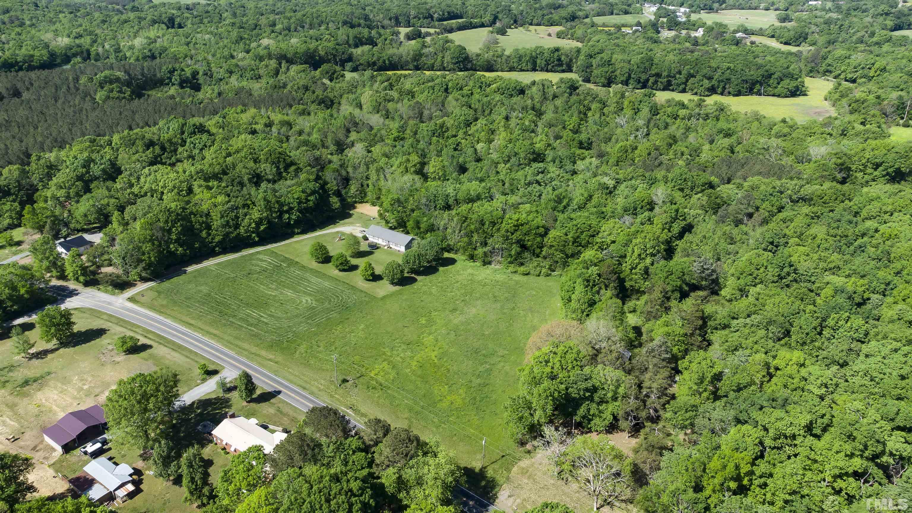 740 Bernard Purvis Road Bennett, NC 27208 - Photo 6 of 23 a view of a garden with a street