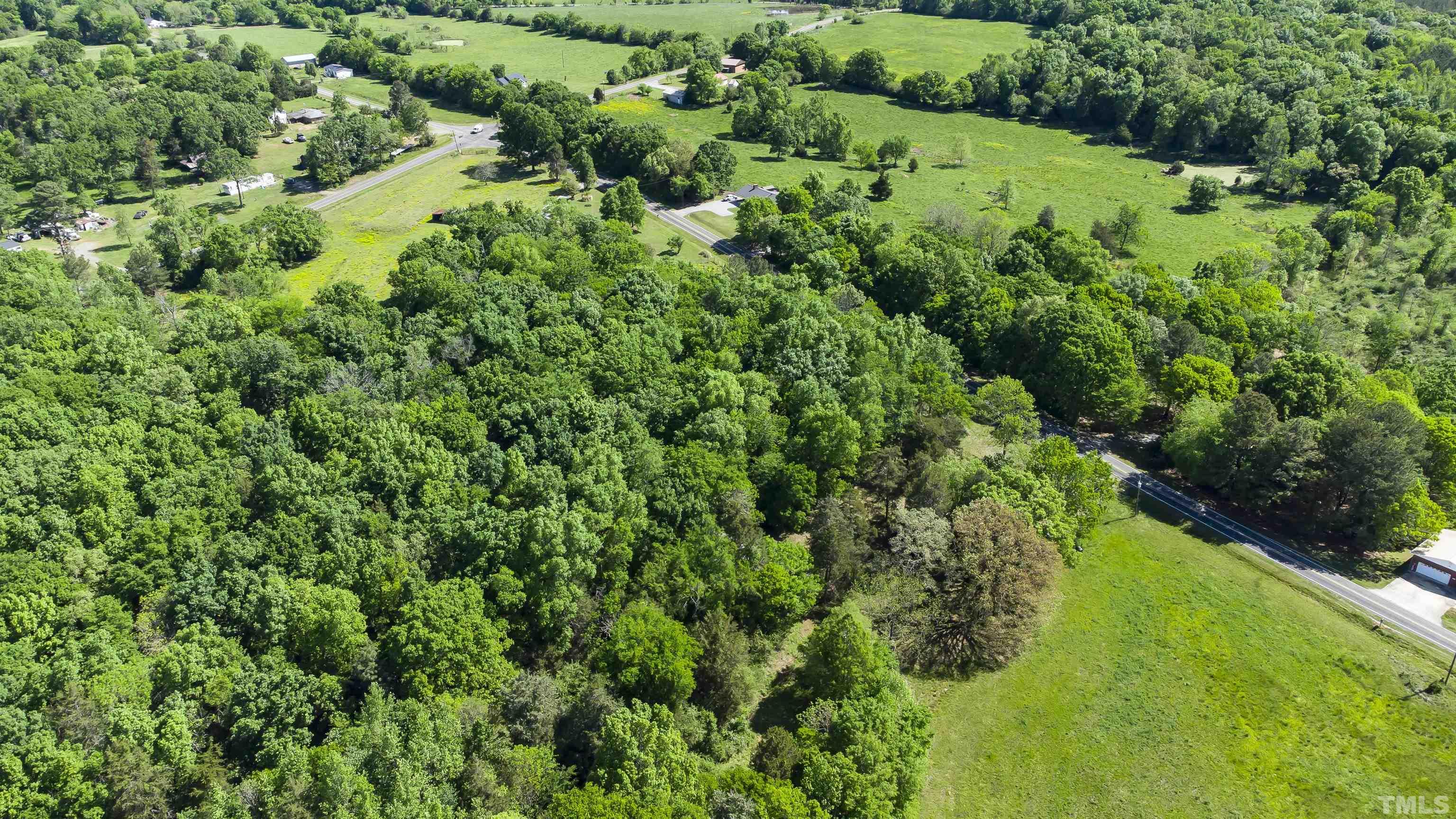 740 Bernard Purvis Road Bennett, NC 27208 - Photo 8 of 23 an aerial view of residential house with outdoor space and trees all around