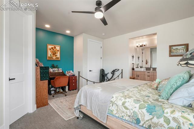 74 Sommerlyn Road Colorado Springs, CO 80906 - Photo 22 of 32 Carpeted bedroom with ceiling fan