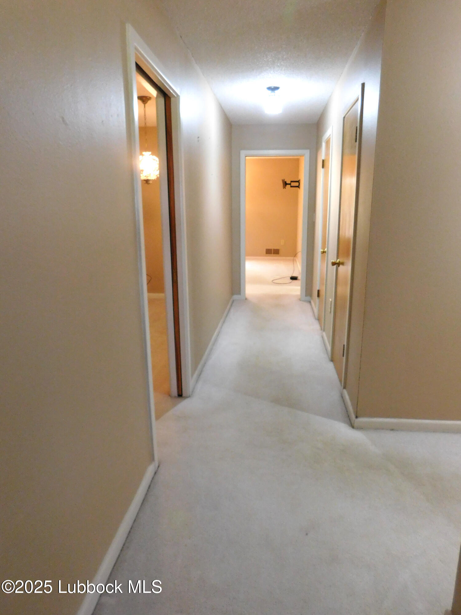1925 Highway 70 Muleshoe, TX 79347 - Photo 24 of 49 a view of a hallway with wooden floor