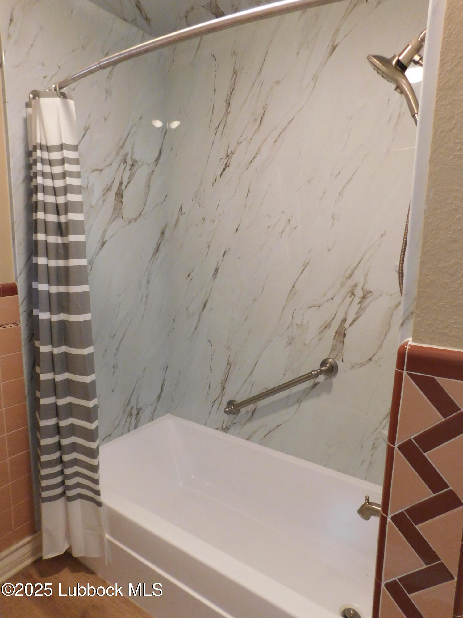 1925 Highway 70 Muleshoe, TX 79347 - Photo 27 of 49 a bathroom with a bathtub and shower