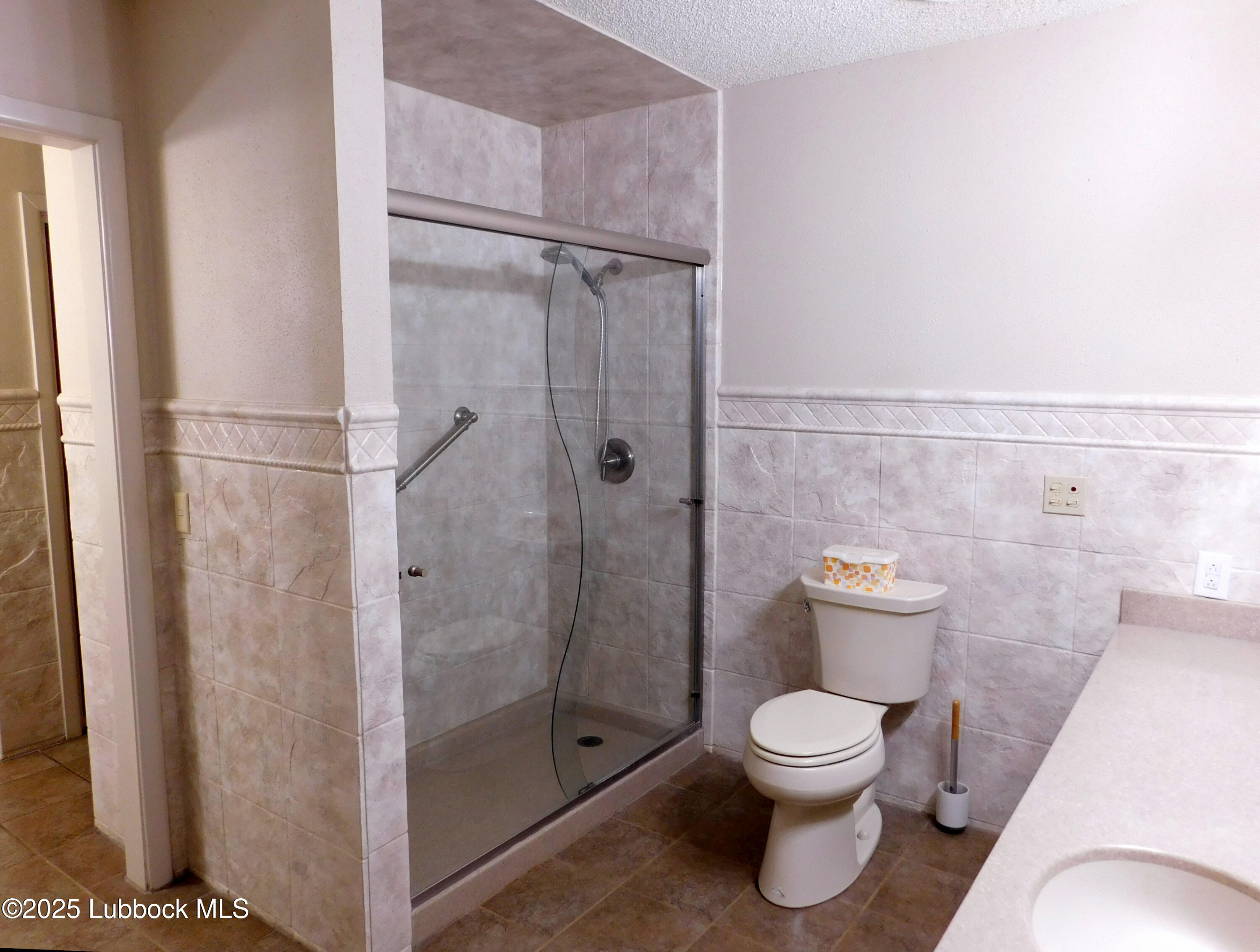 1925 Highway 70 Muleshoe, TX 79347 - Photo 35 of 49 a bathroom with a toilet shower and a sink