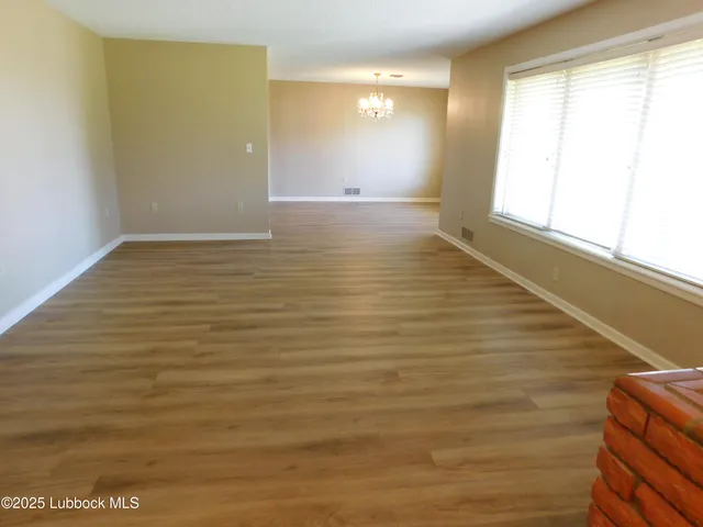 a view of an empty room and window