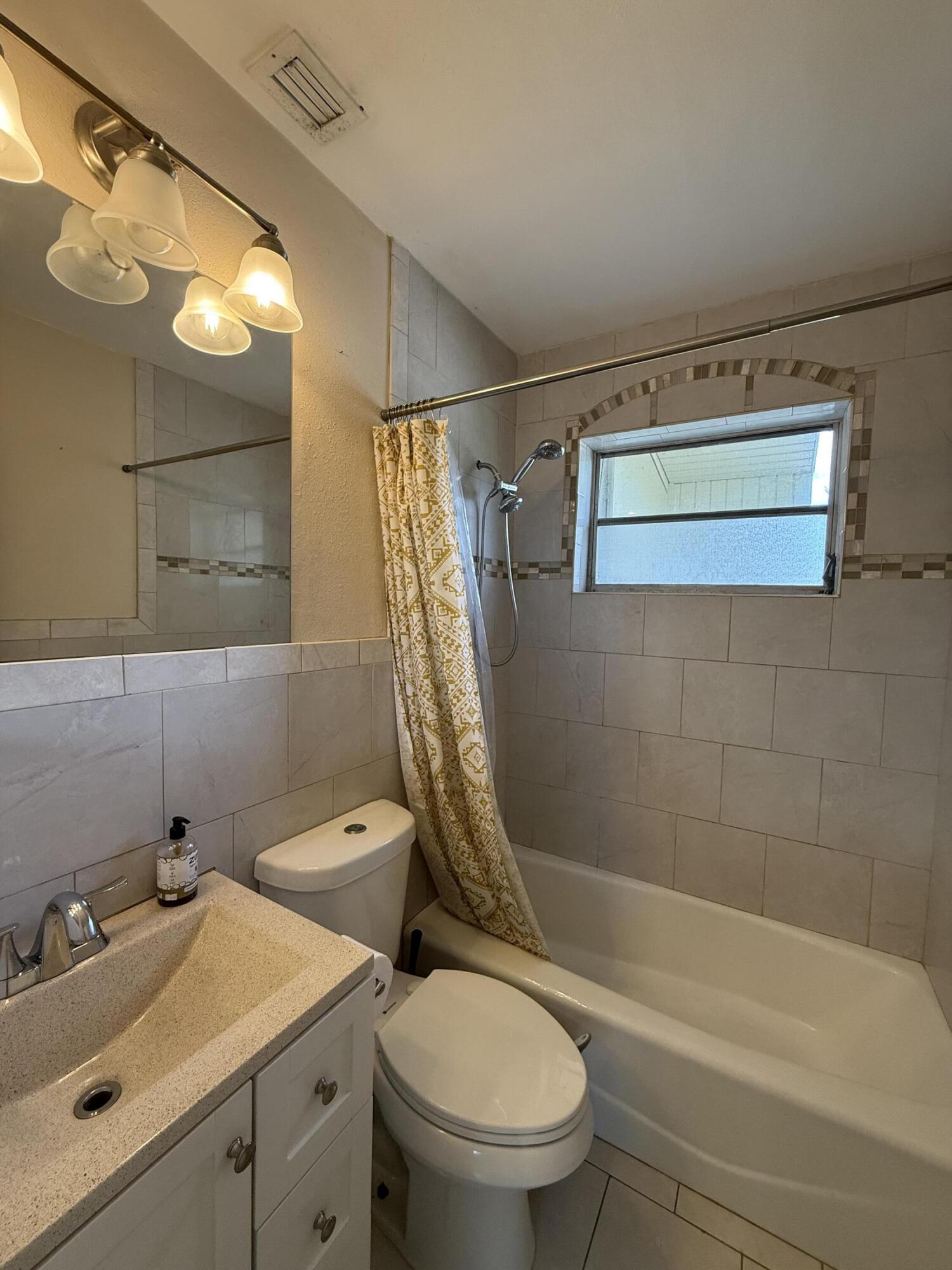 3962-3964 No Name Road Big Pine Key, FL 33043 - Photo 19 of 26 a bathroom with a sink a toilet and shower