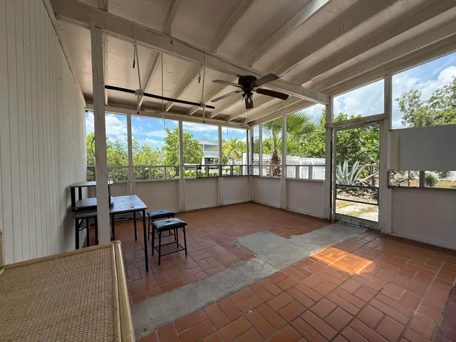 a view of a chairs and table in a room
