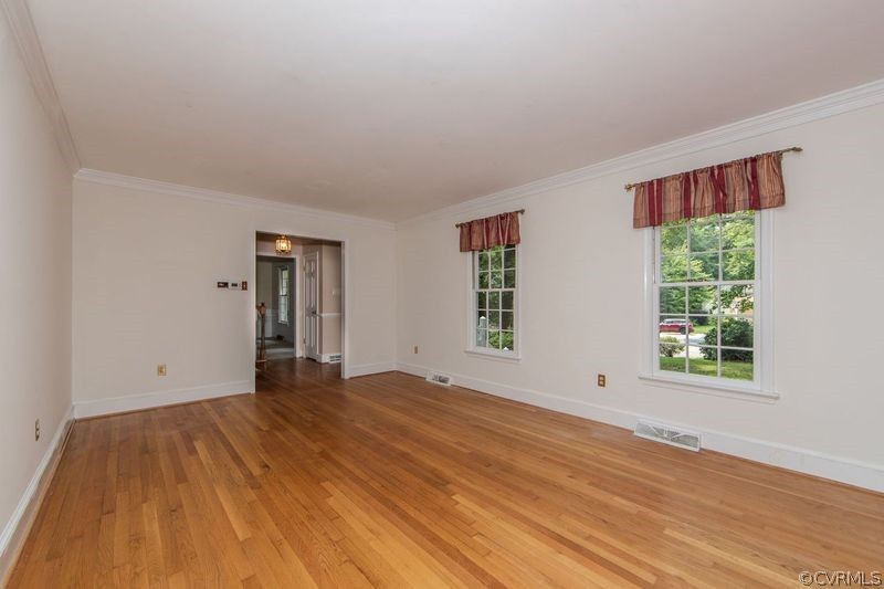 13603 Timber Ridge Court Midlothian, VA 23112 - Photo 11 of 29 a view of an empty room with wooden floor and a window