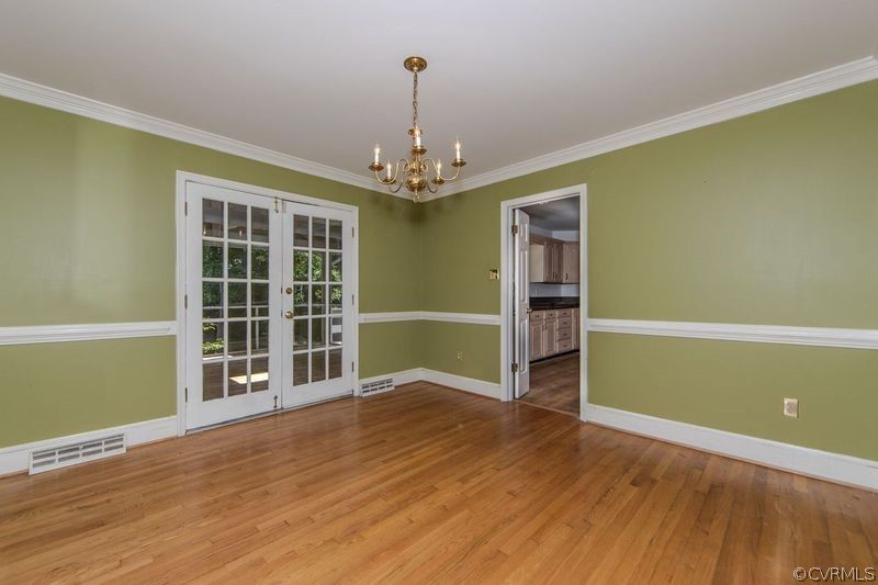 13603 Timber Ridge Court Midlothian, VA 23112 - Photo 13 of 29 a view of an empty room with wooden floor and a window