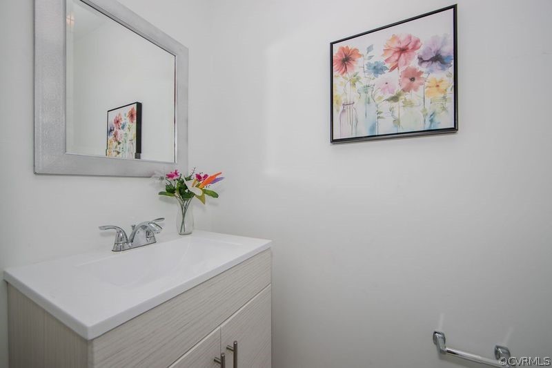 13603 Timber Ridge Court Midlothian, VA 23112 - Photo 14 of 29 a bathroom with a sink and a mirror
