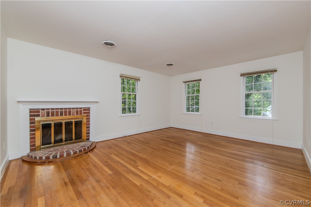 13603 Timber Ridge Court Midlothian, VA 23112 - Photo 16 of 29 an empty room with windows and fireplace
