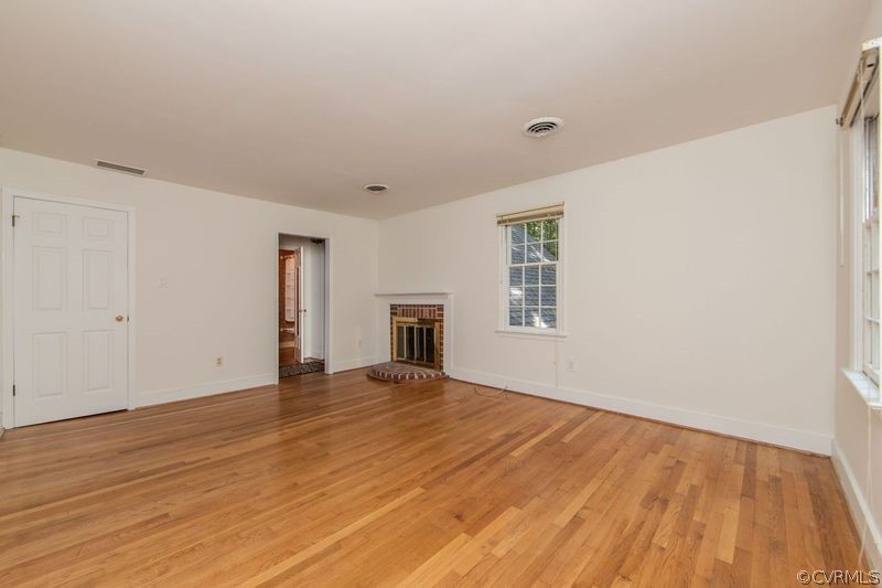 13603 Timber Ridge Court Midlothian, VA 23112 - Photo 17 of 29 a view of an empty room with wooden floor and a window