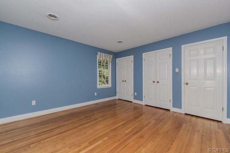 13603 Timber Ridge Court Midlothian, VA 23112 - Photo 23 of 29 a view of an empty room with wooden floor and a window