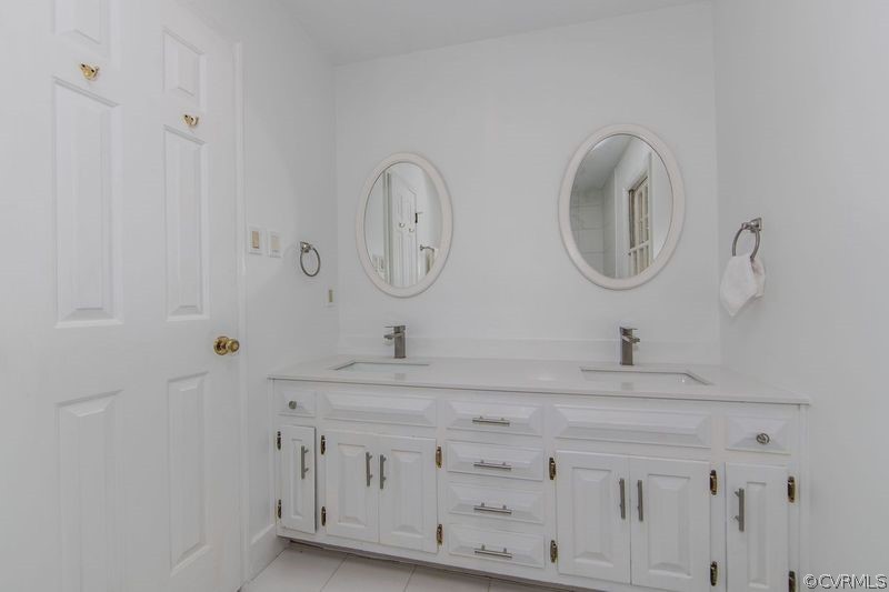 13603 Timber Ridge Court Midlothian, VA 23112 - Photo 24 of 29 a bathroom with a sink and a mirror