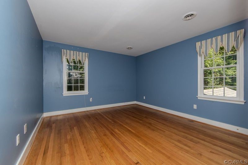 13603 Timber Ridge Court Midlothian, VA 23112 - Photo 25 of 29 a view of an empty room with wooden floor and a window