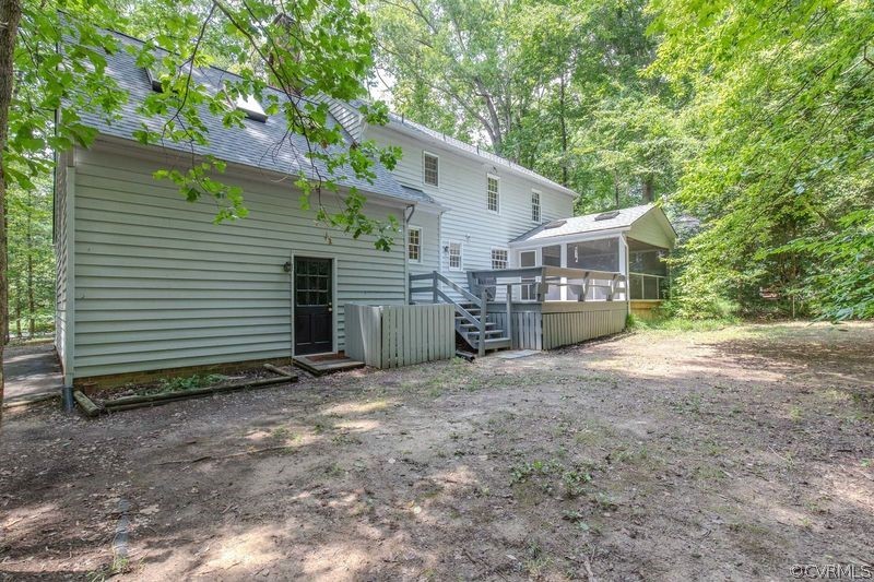 13603 Timber Ridge Court Midlothian, VA 23112 - Photo 3 of 29 a view of a house with a yard and garage