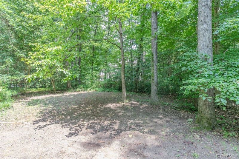 13603 Timber Ridge Court Midlothian, VA 23112 - Photo 5 of 29 a view of a yard with trees in the background