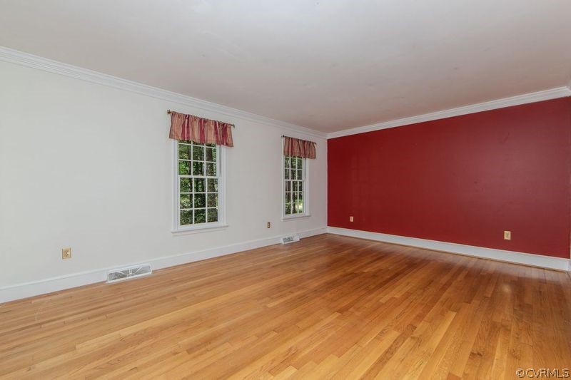 13603 Timber Ridge Court Midlothian, VA 23112 - Photo 10 of 29 a view of an empty room with wooden floor and a window