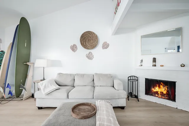 a living room with furniture a couch and garden view