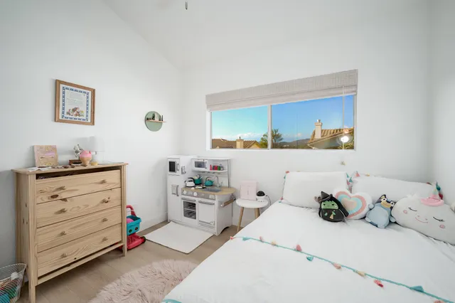 a bathroom with a sink toilet vanity and shower