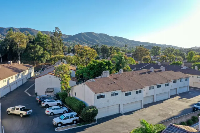 a view of a chairs and table in backyard