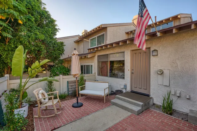 a view of a swimming pool with an outdoor seating