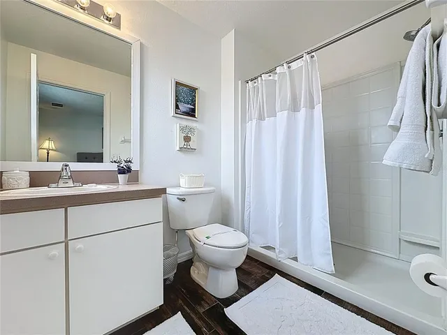 a bed room with a bed and a chandelier