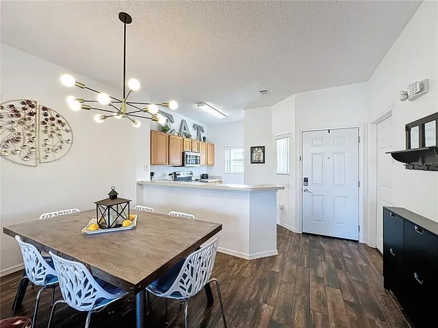 a dining room with furniture and window